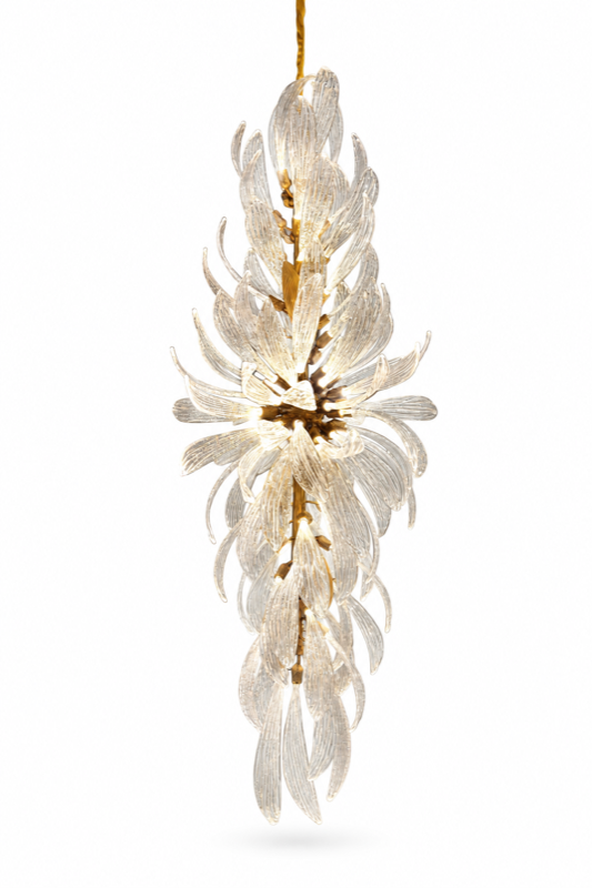 Vertical chandelier with clear glass leaves around a golden-toned central stem