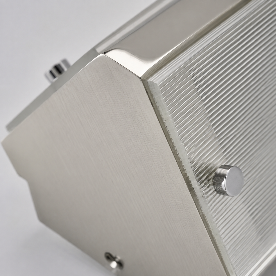 Brushed-metal corner and fastener detail