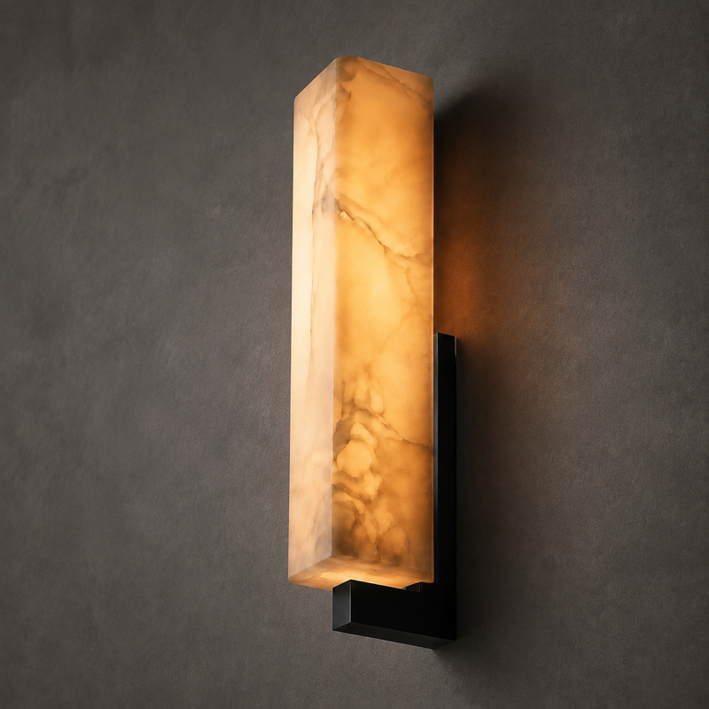 Aureum wall light casting a warm architectural glow