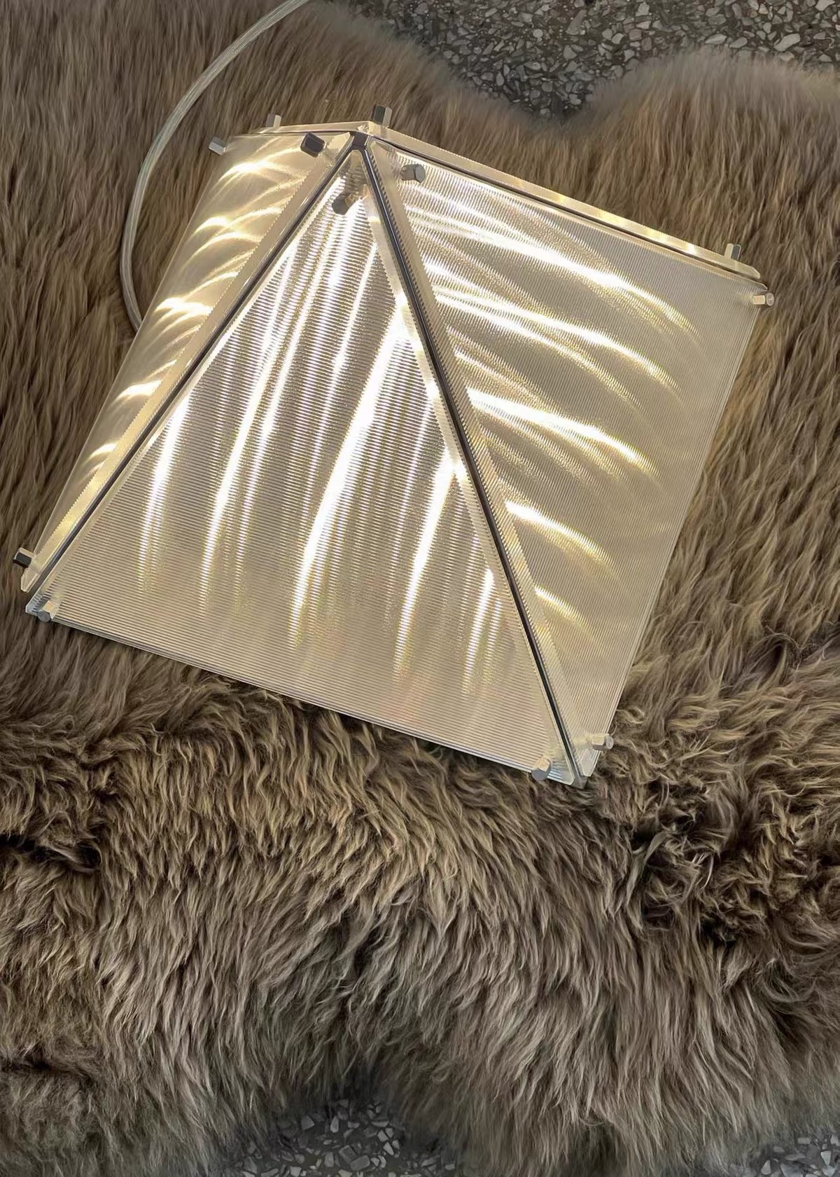 Fragment Prism glass and metal construction detail