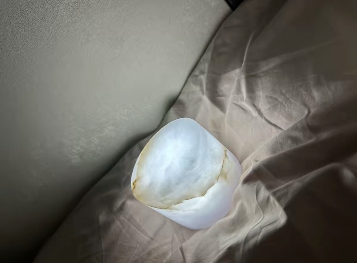 Nube marble lamp glowing in warm light