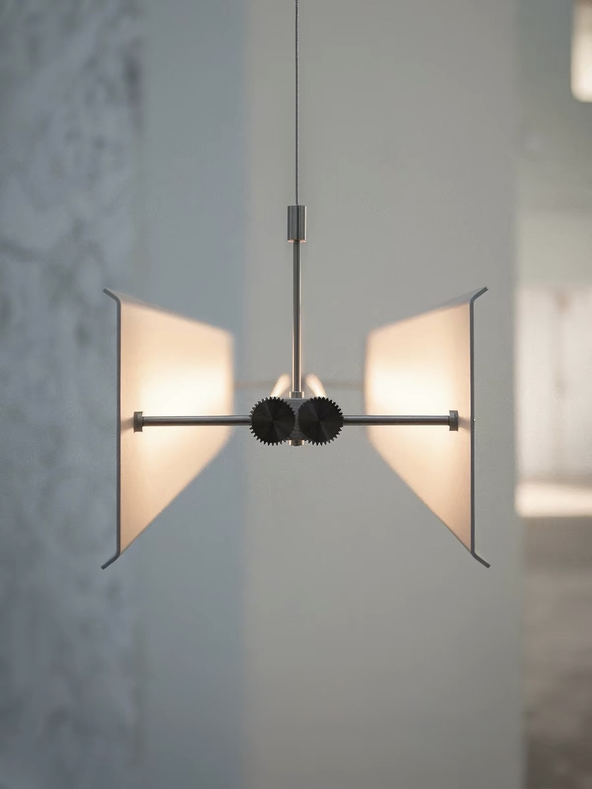 Warm overhead light above a dining setting
