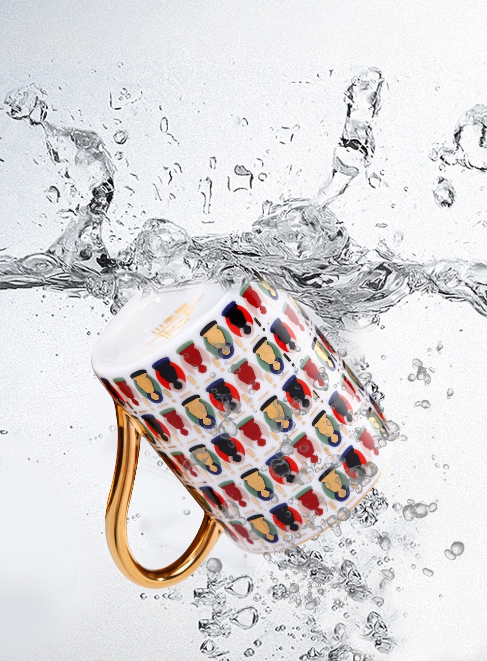 Ivory Dunhuang cup with colourful figure motifs and a gold-tone handle surrounded by splashing water